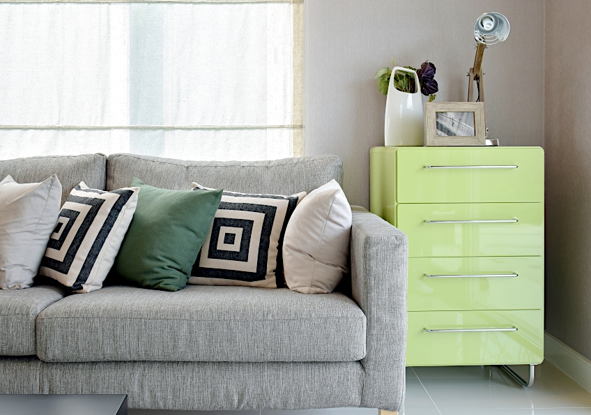 Gray Sofa with Green Accessories